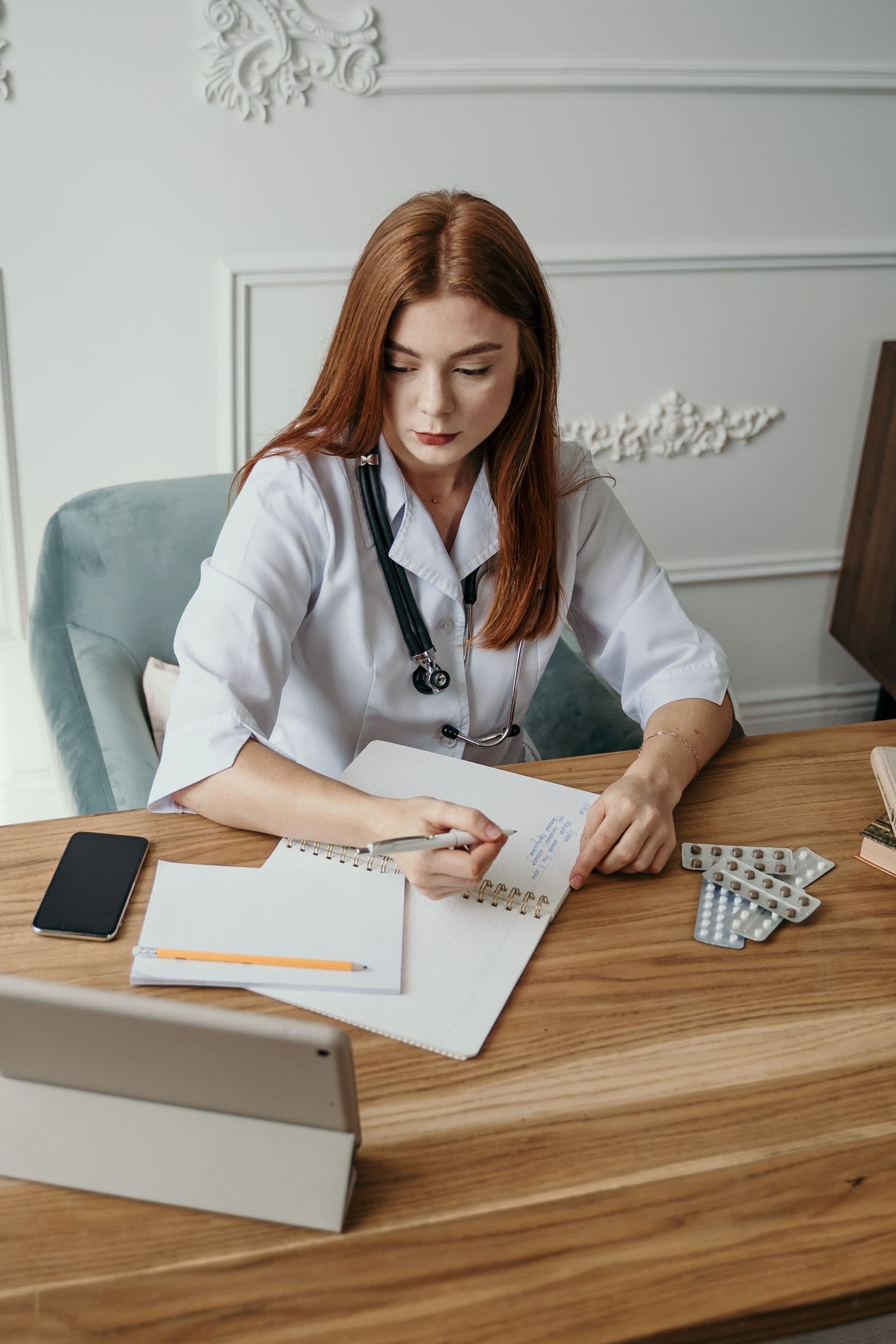 Physician reviewing patient notes at a practice powered by Atlas MedTech